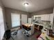 Bright kitchen with white cabinets and a colorful island, offering a functional and creative space at 4402 E New York St, Indianapolis, IN 46201
