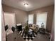 Comfortable living room with neutral tones, patterned rug, and lots of natural light at 4402 E New York St, Indianapolis, IN 46201