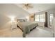 Serene bedroom with a ceiling fan, neutral tones, and a comfortable king-sized bed at 441 E Pine Ridge Dr, Westfield, IN 46074