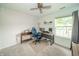 Bright bedroom featuring neutral carpet, ceiling fan and a large window bringing in an abundance of natural light at 441 E Pine Ridge Dr, Westfield, IN 46074