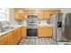 Well-equipped kitchen with stainless steel appliances, oak cabinets, and sleek countertops at 441 E Pine Ridge Dr, Westfield, IN 46074