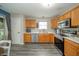 Bright kitchen with stainless steel appliances, ample oak cabinets, and backyard access at 441 E Pine Ridge Dr, Westfield, IN 46074