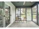 Cozy screened-in porch with seating and serene views of the backyard at 441 E Pine Ridge Dr, Westfield, IN 46074