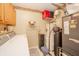 Functional utility room with a washer, dryer, water heater, shelving and other useful storage at 441 E Pine Ridge Dr, Westfield, IN 46074