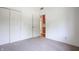 Bedroom with neutral carpet, a closet, and view to another room in the home at 4462 Carya Sq, Columbus, IN 47201