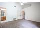 Spacious bedroom with carpet, view to the bathroom, and a doorway to another room at 4462 Carya Sq, Columbus, IN 47201