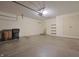 Wide garage featuring a concrete floor, automatic door opener, and built in shelving at 4462 Carya Sq, Columbus, IN 47201
