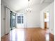 Open-concept dining and living area with wood floors and natural light at 4462 Carya Sq, Columbus, IN 47201
