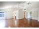 Open-concept living room with high ceilings, hardwood floors, and bright, airy feel at 4462 Carya Sq, Columbus, IN 47201