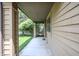 Covered walkway showing a view to the side yard and fence at 4462 Carya Sq, Columbus, IN 47201