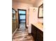 A well-lit bathroom with walk-in shower and updated vanity at 4723 Goldenrain Ct, Indianapolis, IN 46237