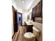 Spacious bathroom with double sinks, wood cabinets, and modern fixtures, providing a functional space at 4723 Goldenrain Ct, Indianapolis, IN 46237