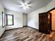 A bright bedroom with natural light, hardwood flooring and ceiling fan at 4723 Goldenrain Ct, Indianapolis, IN 46237