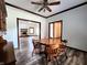 Comfortable dining room with view to a fireplace, hardwood floors and classic wooden table at 4723 Goldenrain Ct, Indianapolis, IN 46237
