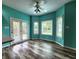 Bright eat-in area with lots of windows and a door to the backyard, creating a cozy and inviting space at 4723 Goldenrain Ct, Indianapolis, IN 46237