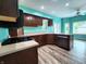 Bright kitchen featuring wood floors, stainless steel appliances, and ample counter space at 4723 Goldenrain Ct, Indianapolis, IN 46237