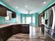 Eat-in kitchen with stainless steel appliances, plenty of cabinet space, island and wood floors at 4723 Goldenrain Ct, Indianapolis, IN 46237