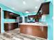 Open kitchen layout with stainless steel appliances, wood floors and plenty of counter space at 4723 Goldenrain Ct, Indianapolis, IN 46237