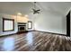 Bright living room with wood floors, vaulted ceilings, fireplace and large windows with natural light at 4723 Goldenrain Ct, Indianapolis, IN 46237
