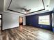 A luxurious main bedroom features a ceiling fan, wood floors and bright natural light at 4723 Goldenrain Ct, Indianapolis, IN 46237