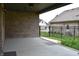 Covered patio features brick, concrete floor, and a wrought iron fence at 4723 Goldenrain Ct, Indianapolis, IN 46237