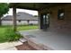 Brick patio with ceiling fans, looking out to the backyard, perfect for relaxing and entertaining outdoors at 4723 Goldenrain Ct, Indianapolis, IN 46237