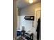 Bright bathroom featuring a blue glass sink, towel rack, and white beadboard wall design at 48 N Audubon Rd, Indianapolis, IN 46219