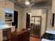 Charming kitchen featuring a stainless steel refrigerator, modern appliances, and a decorative tin ceiling at 48 N Audubon Rd, Indianapolis, IN 46219