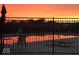 Tranquil sunset reflected in the community pool, creating a serene and picturesque setting at 4817 Allium Dr, Plainfield, IN 46168