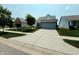 Charming single-Gathering home with a well-maintained lawn, long driveway and an attached two-car garage at 4817 Allium Dr, Plainfield, IN 46168