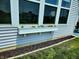 Exterior of home features a window box with flowers and a small garden, adding charm at 4817 Allium Dr, Plainfield, IN 46168