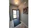 Bright foyer featuring neutral paint, tile flooring, an open door, and decorative wall art at 4817 Allium Dr, Plainfield, IN 46168