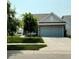Charming home with a well-maintained lawn and a two-car garage, offering curb appeal and convenience at 4817 Allium Dr, Plainfield, IN 46168