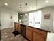 Kitchen island featuring pendant lighting, stainless steel appliances, and ample counter space for dining at 4817 Allium Dr, Plainfield, IN 46168