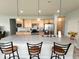 Modern kitchen featuring a large island, stainless steel appliances, and stylish pendant lighting at 4817 Allium Dr, Plainfield, IN 46168