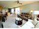 Cozy living room with neutral tones, modern furniture, and open layout to dining and kitchen areas at 4817 Allium Dr, Plainfield, IN 46168