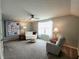 A cozy living room with neutral-colored walls, plush seating, and a ceiling fan at 4817 Allium Dr, Plainfield, IN 46168