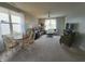 Comfortable living room with natural light, a dining area, plush seating, and a calming ambiance at 4817 Allium Dr, Plainfield, IN 46168