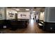 Welcoming lobby with wood-paneled walls, reception desk, and artwork creating a professional and inviting atmosphere at 4817 Allium Dr, Plainfield, IN 46168