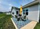 Cozy outdoor patio with a round table, four chairs, an umbrella and a stylish blue rug at 4817 Allium Dr, Plainfield, IN 46168