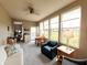 Open sun room with views of lush green landscaping, a ceiling fan, and comfortable seating at 4817 Allium Dr, Plainfield, IN 46168