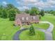 Beautiful aerial view of the home on a large green lot with a winding driveway at 505 Jones Pl, Martinsville, IN 46151
