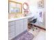 Well-lit bathroom featuring granite counters, a decorative mirror and modern fixtures at 505 Jones Pl, Martinsville, IN 46151