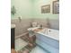 Elegant bathroom featuring a standalone tub, stylish fixtures, and tiled accents at 505 Jones Pl, Martinsville, IN 46151