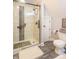 Modern bathroom with glass shower door, subway tiles with decorative black accents, and sleek fixtures at 505 Jones Pl, Martinsville, IN 46151