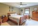 Comfortable bedroom featuring wood furniture, carpeted floors, and an inviting color palette at 505 Jones Pl, Martinsville, IN 46151