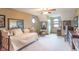 Bedroom with a daybed, sitting area with arched windows, and a ceiling fan at 505 Jones Pl, Martinsville, IN 46151