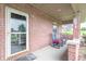 The cozy porch has room to sit and relax, and is constructed of brick and concrete at 505 Jones Pl, Martinsville, IN 46151