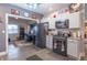 Well-equipped kitchen with stainless steel appliances and custom cabinets, with views to connected living spaces at 505 Jones Pl, Martinsville, IN 46151