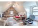 Attic living space with vaulted ceilings, a ceiling fan, and plenty of natural lighting at 505 Jones Pl, Martinsville, IN 46151
